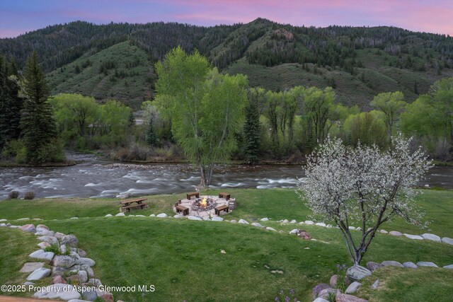 2134 Lower River Rd, Snowmass, CO 81654 - view of mountain background with a heavily wooded area and a nearby body of water