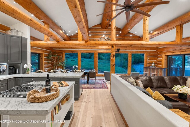 2134 Lower River Rd, Snowmass, CO 81654 - living area featuring log walls, light wood finished floors, a ceiling fan, and recessed lighting