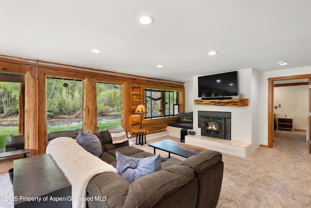 2134 Lower River Rd, Snowmass, CO 81654 - carpeted living area with recessed lighting, a tile fireplace, and baseboards