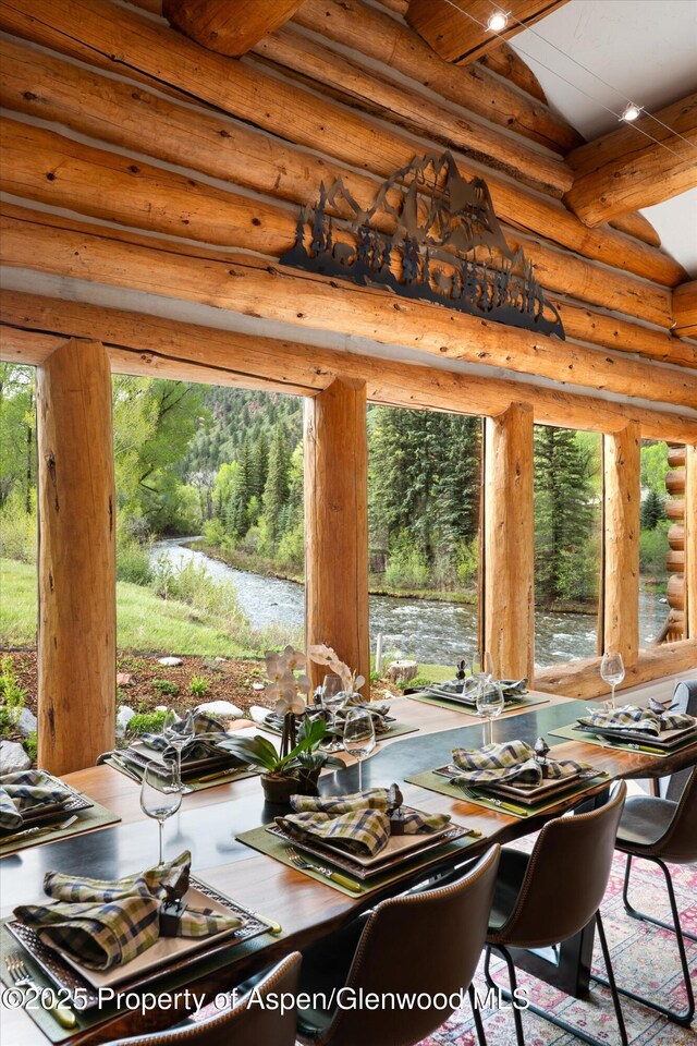 2134 Lower River Rd, Snowmass, CO 81654 - dining area featuring rustic walls