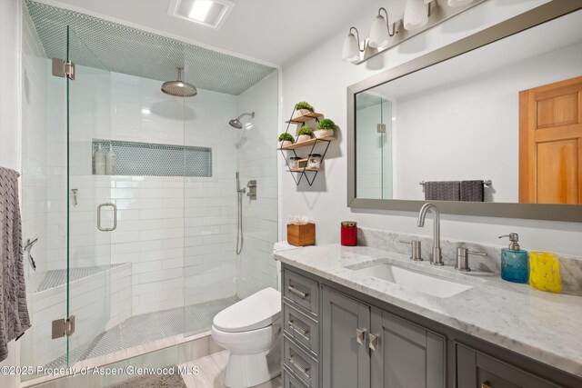2134 Lower River Rd, Snowmass, CO 81654 - full bathroom with toilet, vanity, and a shower stall