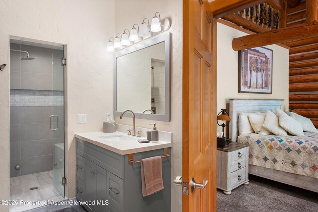 2134 Lower River Rd, Snowmass, CO 81654 - full bath with log walls, a shower stall, and vanity