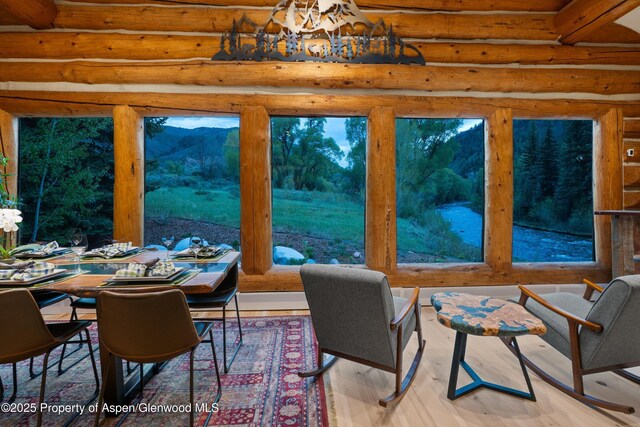 2134 Lower River Rd, Snowmass, CO 81654 - dining room featuring rustic walls and wood finished floors