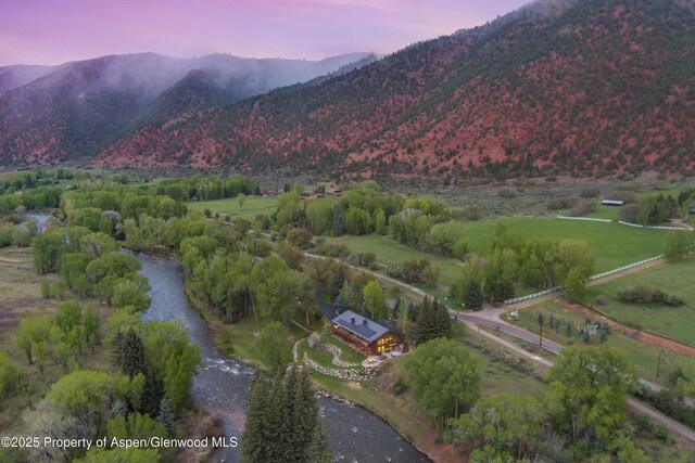 2134 Lower River Rd, Snowmass, CO 81654 - aerial overview of property's location featuring a mountainous background and rural landscape