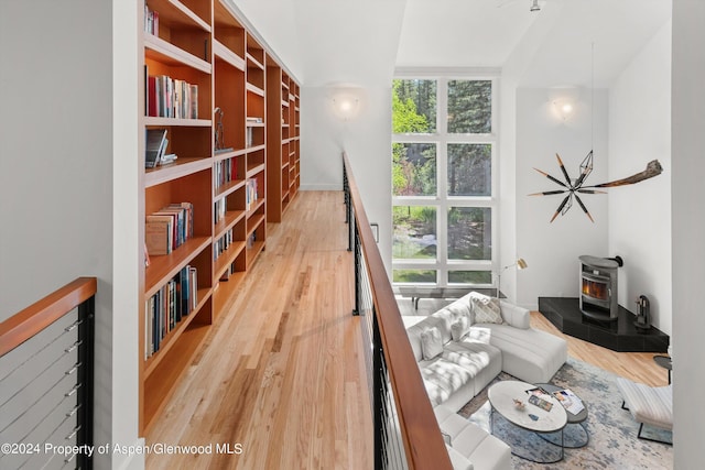 living room with hardwood / wood-style flooring and a wood stove