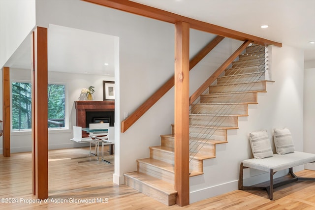 stairs with wood-type flooring