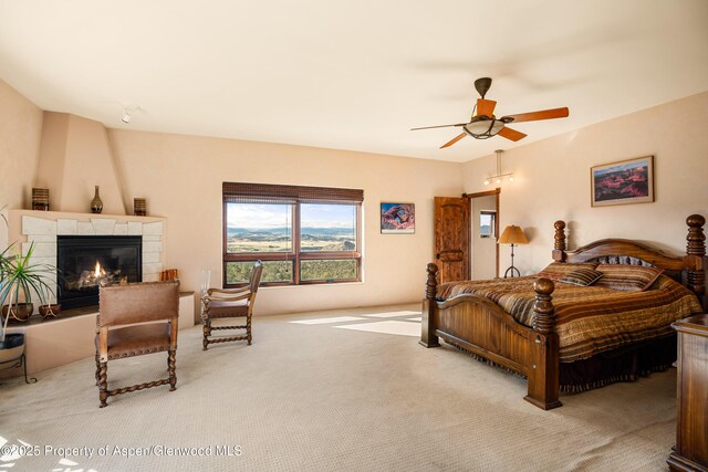 1212 County Road 238th Rd Unit 238, Silt, CO 81652 - carpeted bedroom with a fireplace and ceiling fan