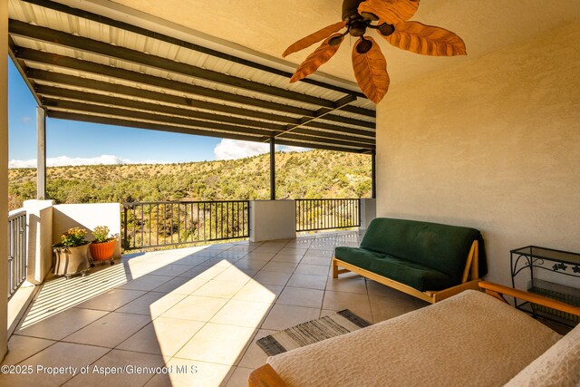 1212 County Road 238th Rd Unit 238, Silt, CO 81652 - view of patio / terrace with a balcony, a ceiling fan, and a mountain view