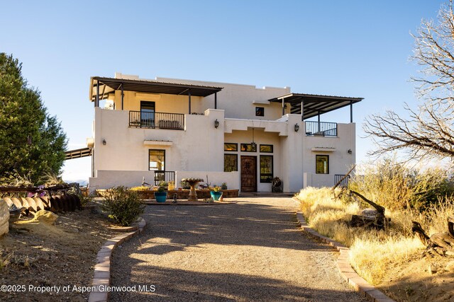 1212 County Road 238th Rd Unit 238, Silt, CO 81652 - view of front facade featuring a balcony and stucco siding
