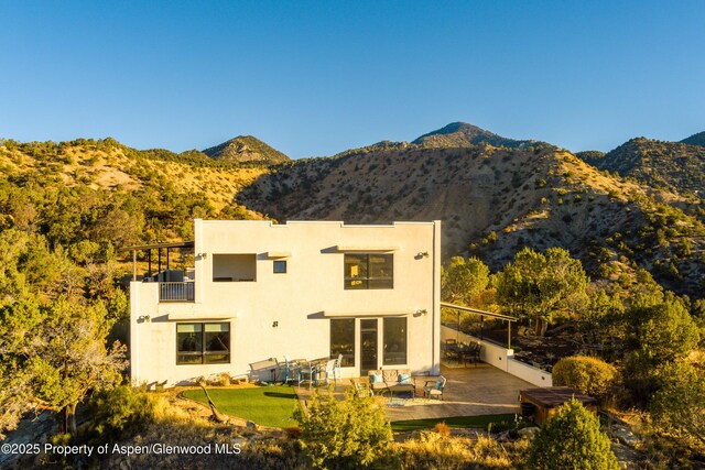 1212 County Road 238th Rd Unit 238, Silt, CO 81652 - back of house featuring a balcony, a mountain view, and stucco siding