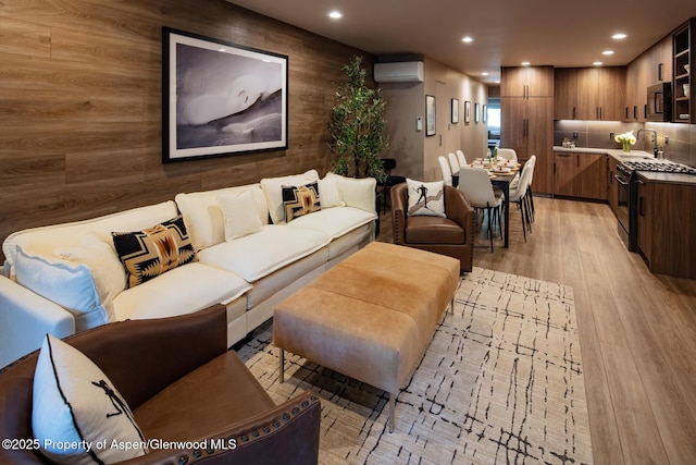 100 E Dean St Unit 1B, Aspen, CO 81611 - living room with a wall mounted air conditioner, light wood-type flooring, and recessed lighting
