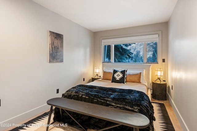 100 E Dean St Unit 1B, Aspen, CO 81611 - bedroom with wood finished floors and baseboards
