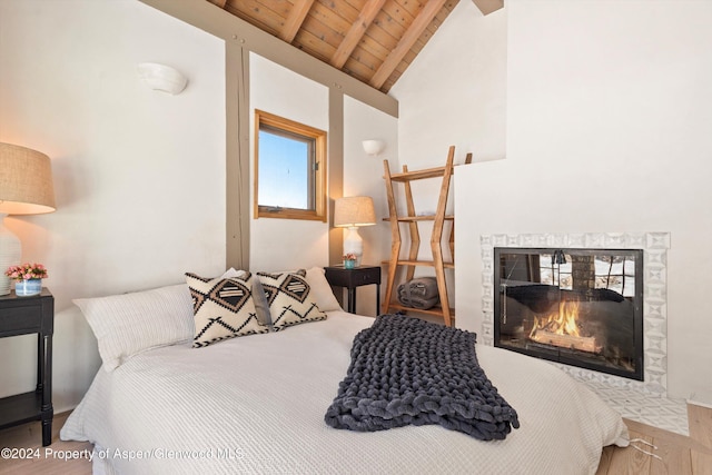 bedroom featuring lofted ceiling with beams and wooden ceiling