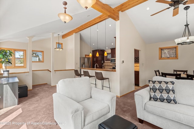 536 Spruce St, Aspen, CO 81611 - living area with light colored carpet, a ceiling fan, lofted ceiling with beams, and baseboards