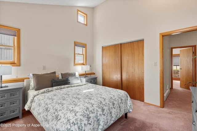 536 Spruce St, Aspen, CO 81611 - carpeted bedroom with a towering ceiling, baseboards, and a closet