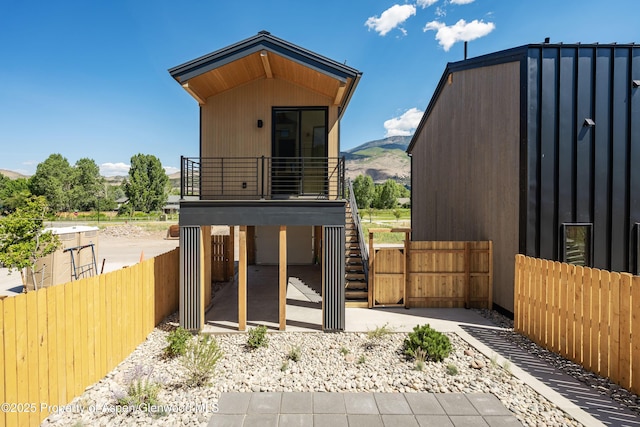 366 Stotts Mill Rd, Basalt, CO 81621 - back of house featuring a mountain view, a balcony, and a patio area