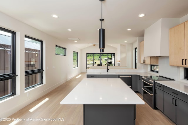 366 Stotts Mill Rd, Basalt, CO 81621 - kitchen featuring light countertops, double oven range, light wood-style floors, lofted ceiling, and recessed lighting