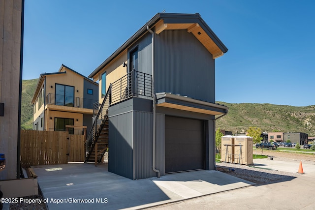 366 Stotts Mill Rd, Basalt, CO 81621 - view of front of property with a mountain view, stairway, a garage, and concrete driveway