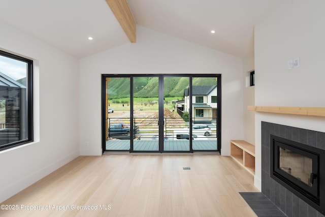366 Stotts Mill Rd, Basalt, CO 81621 - unfurnished living room with a tiled fireplace, light wood-style floors, and recessed lighting