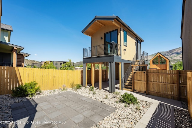 366 Stotts Mill Rd, Basalt, CO 81621 - back of house featuring a patio, a fenced backyard, stairway, and a mountain view