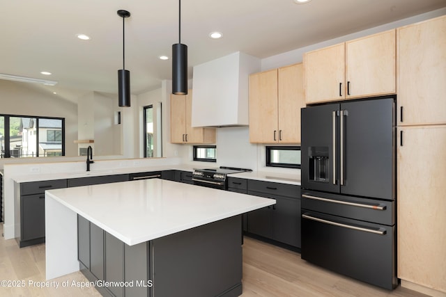 366 Stotts Mill Rd, Basalt, CO 81621 - kitchen featuring light brown cabinets, fridge with ice dispenser, a peninsula, light wood-style flooring, and light countertops