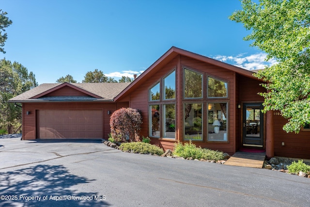 10 Cedar Cv, Glenwood Springs, CO 81601 - view of front of property with asphalt driveway, a garage, and a shingled roof