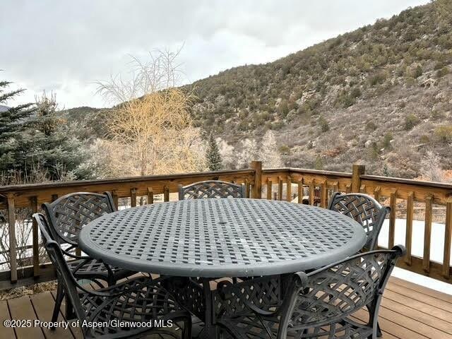 wooden deck with outdoor dining space