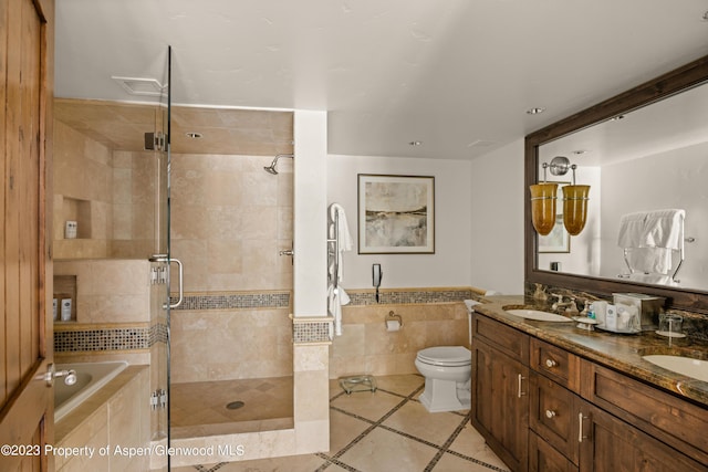 full bathroom featuring tile patterned floors, vanity, separate shower and tub, and toilet