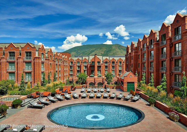 view of pool with a mountain view