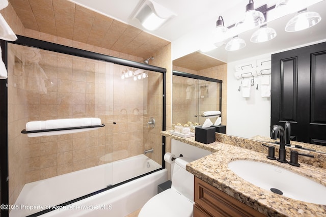 901 E Hyman Ave Unit 4, Aspen, CO 81611 - bathroom with vanity, bath / shower combo with glass door, and toilet