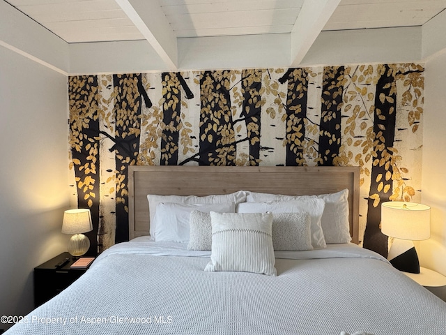 bedroom featuring beamed ceiling
