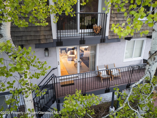 901 E Hyman Ave Unit 4, Aspen, CO 81611 - view of exterior entry with a balcony and stucco siding