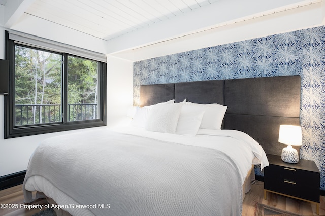 901 E Hyman Ave Unit 4, Aspen, CO 81611 - bedroom with wood finished floors and beamed ceiling