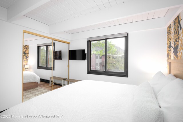 901 E Hyman Ave Unit 4, Aspen, CO 81611 - bedroom featuring wood finished floors and wood ceiling with exposed beams