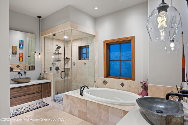 1185 Heritage Dr, Carbondale, CO 81623 - bathroom featuring vanity, a garden tub, a shower stall, and tile patterned flooring