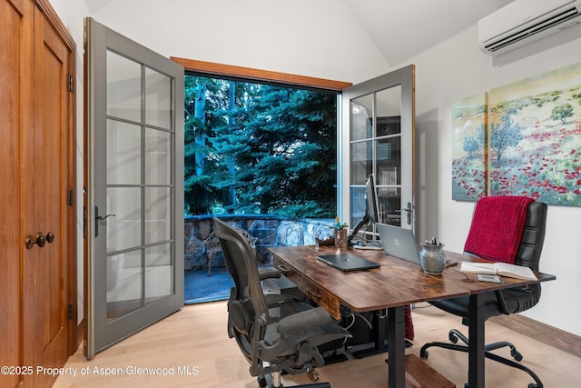 1185 Heritage Dr, Carbondale, CO 81623 - office with a wall mounted air conditioner, light wood finished floors, vaulted ceiling, and french doors