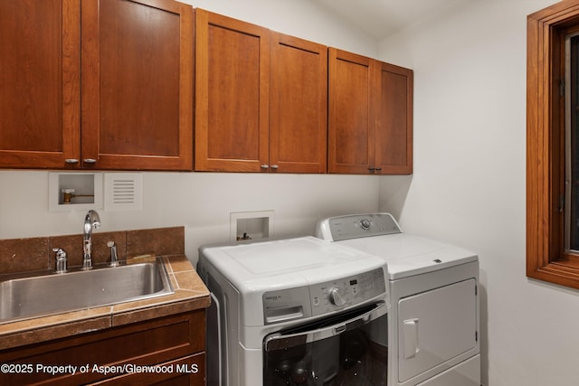 1185 Heritage Dr, Carbondale, CO 81623 - laundry area with independent washer and dryer and cabinet space