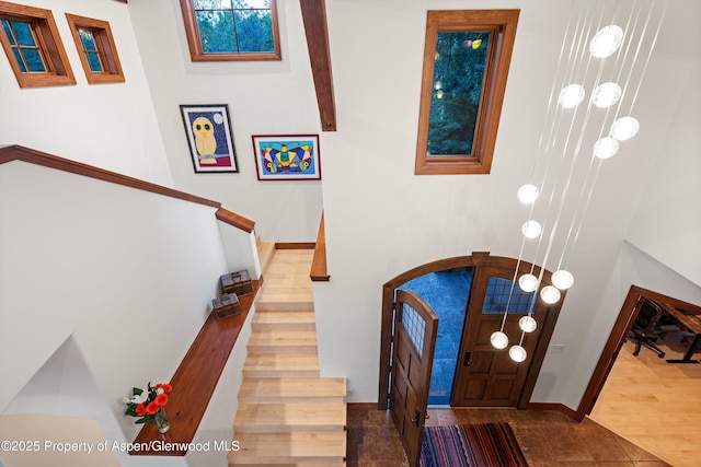 1185 Heritage Dr, Carbondale, CO 81623 - entrance foyer featuring stairway and arched walkways