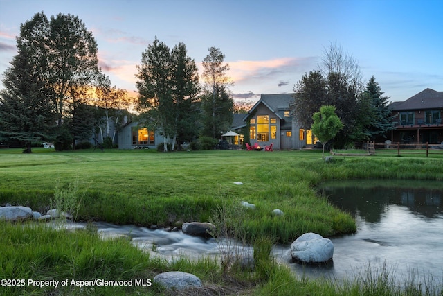 1185 Heritage Dr, Carbondale, CO 81623 - yard at dusk featuring a yard and a water view