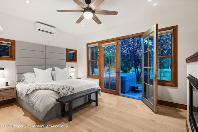 1185 Heritage Dr, Carbondale, CO 81623 - bedroom with a wall mounted AC, access to outside, light wood finished floors, recessed lighting, and ceiling fan