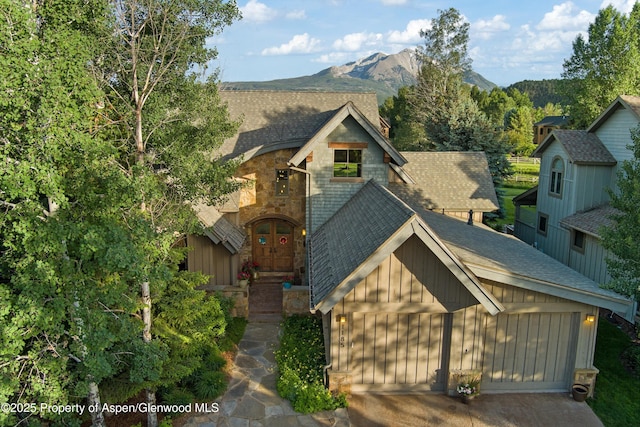 1185 Heritage Dr, Carbondale, CO 81623 - view of front of property featuring a shingled roof, a chimney, and a mountain view
