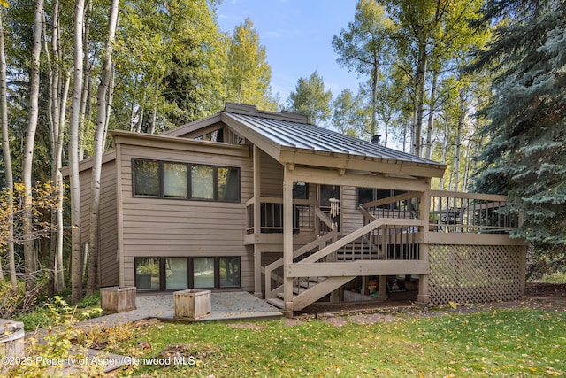 645 Sneaky Ln, Aspen, CO 81611 - rear view of property with stairway, a standing seam roof, metal roof, a wooden deck, and a patio
