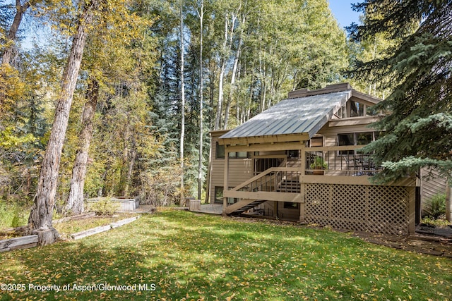 645 Sneaky Ln, Aspen, CO 81611 - view of grassy yard featuring stairway and a deck