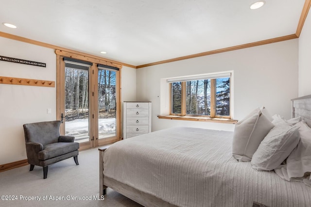 bedroom featuring access to exterior, carpet floors, and ornamental molding