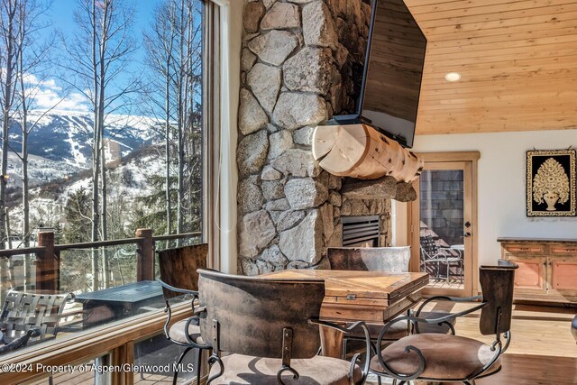 stairs featuring a fireplace, high vaulted ceiling, french doors, and a notable chandelier