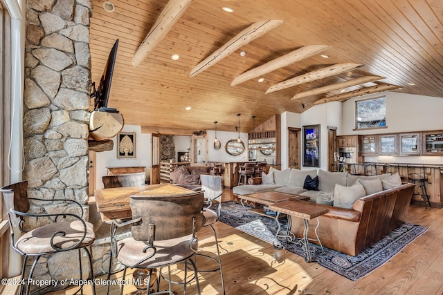 living room featuring beamed ceiling, high vaulted ceiling, wood ceiling, and light hardwood / wood-style floors