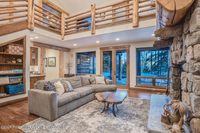 kitchen featuring a fireplace, sink, wooden ceiling, beamed ceiling, and hanging light fixtures