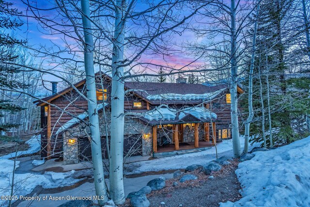 snow covered deck featuring a mountain view