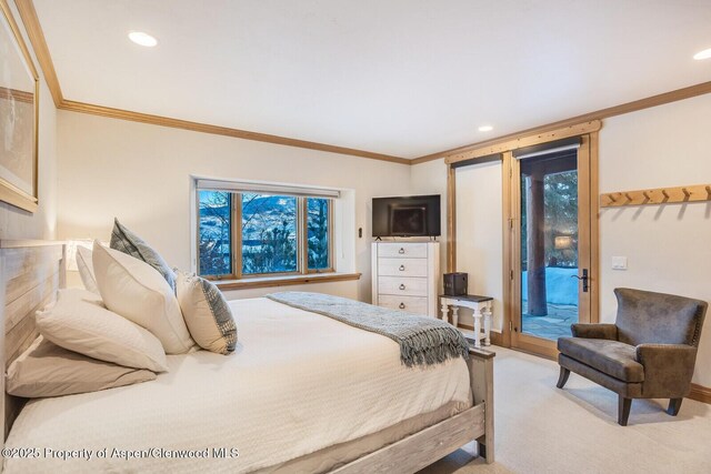 bedroom featuring ensuite bathroom and ornamental molding