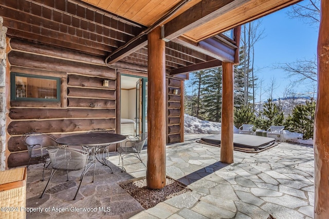 view of patio / terrace featuring a covered hot tub